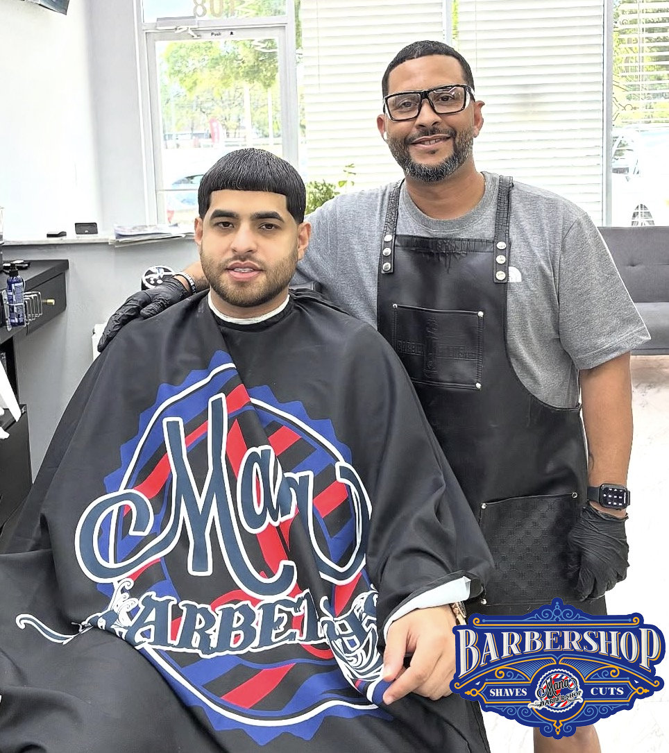 Mana barber with a client after a fresh haircut