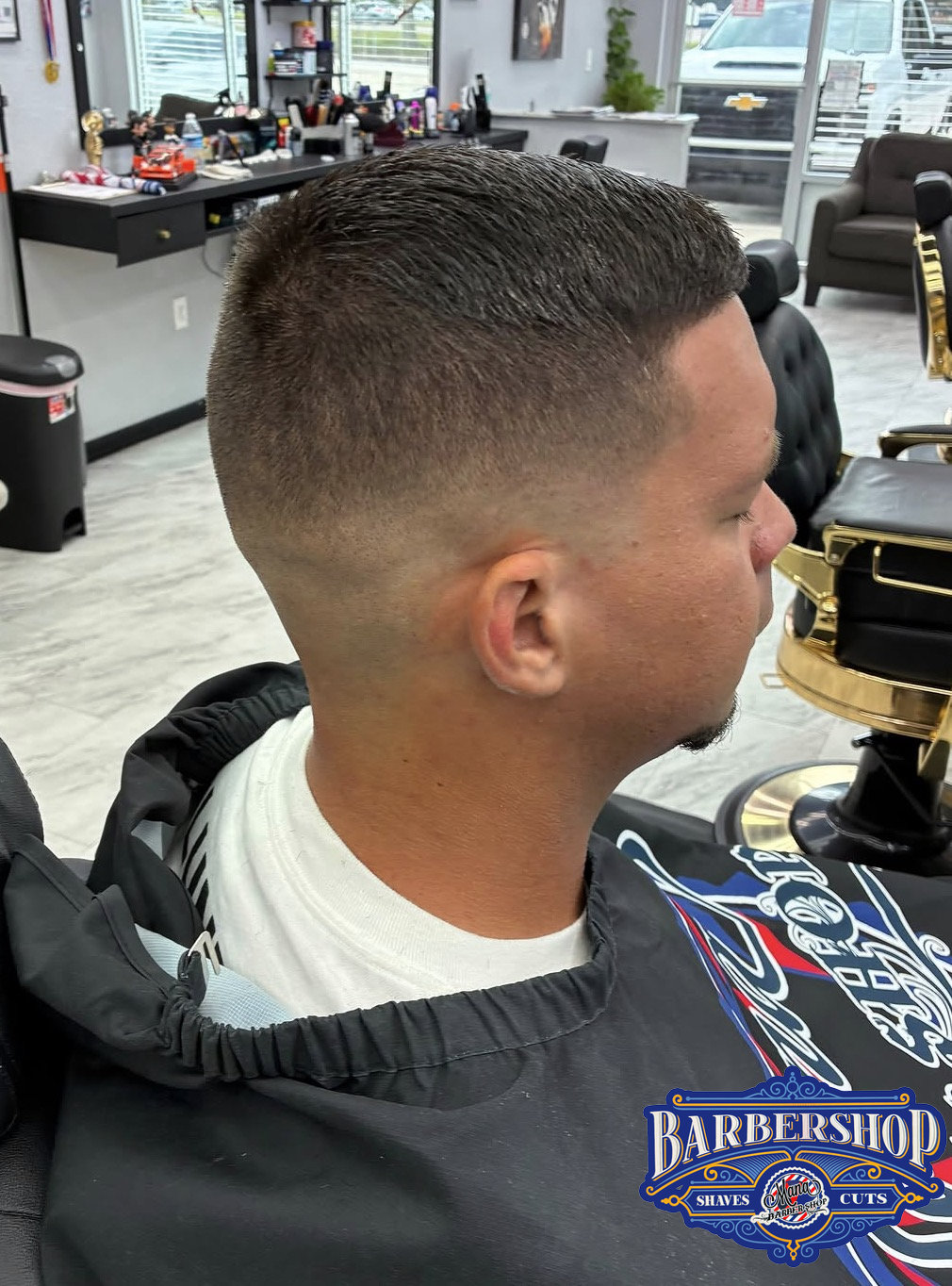 Clean fade haircut finished at Mana Barbershop