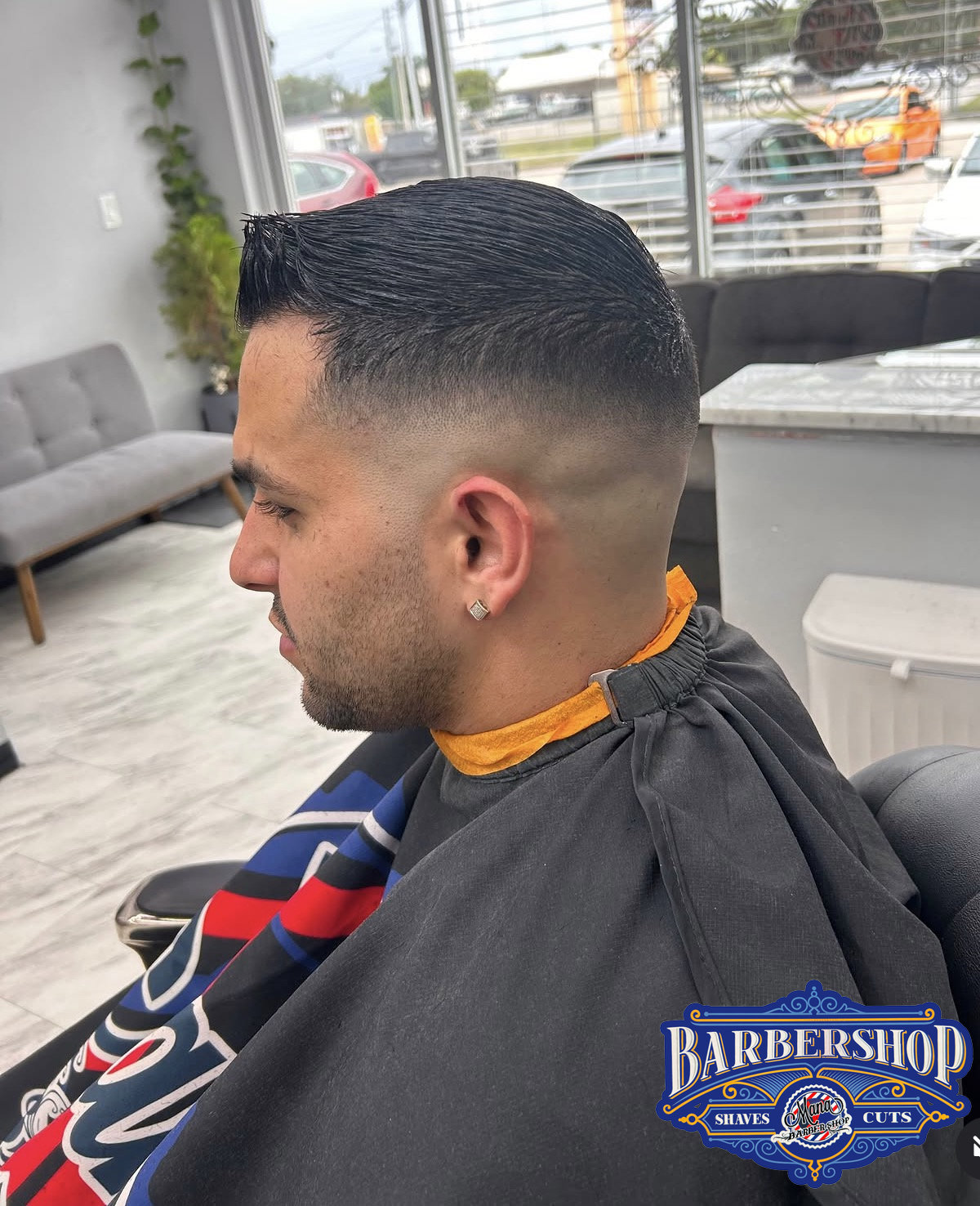 Precision fade and styled haircut at Mana Barbershop